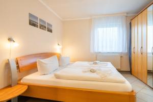 Postel nebo postele na pokoji v ubytování Ferienwohnungen Kienast