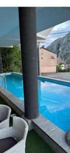 a view of a swimming pool from a building at Sky Aslan Mostar in Mostar