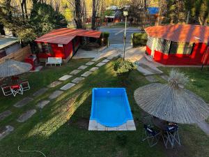an aerial view of a yard with umbrellas at Complejo el trébol in Potrerillos