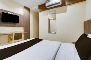 Ένα ή περισσότερα κρεβάτια σε δωμάτιο στο Hotel O Casa Royal Residency +23 φωτογραφίες