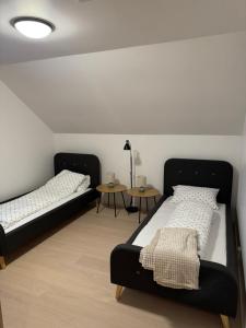 En eller flere senge i et værelse på Villa