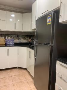 Η κουζίνα ή μικρή κουζίνα στο Strategically located apartment