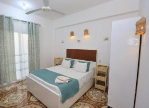 Ένα ή περισσότερα κρεβάτια σε δωμάτιο στο Akhet House