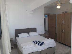 Postel nebo postele na pokoji v ubytování SUBÜŞAH Suit Apart Konaklama + 6 fotografií