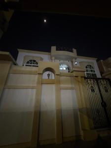 a church at night with the moon in the sky at Lang Homes in Abu Dhabi +10 photos