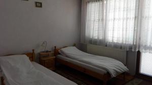 Postel nebo postele na pokoji v ubytování Tsvetkovi Guest House