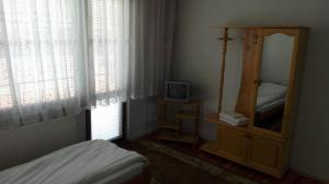 Postel nebo postele na pokoji v ubytování Tsvetkovi Guest House
