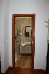 a bathroom with a sink and a mirror at Uptown Madalenas in Funchal +49 photos