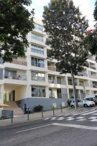 an apartment building on the side of a street at Uptown Madalenas in Funchal