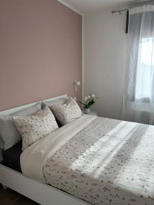 Ένα ή περισσότερα κρεβάτια σε δωμάτιο στο AlMi House - Colline del Prosecco