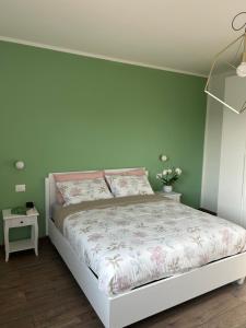 Ένα ή περισσότερα κρεβάτια σε δωμάτιο στο AlMi House - Colline del Prosecco