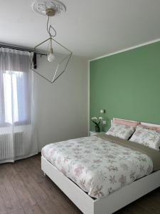Ένα ή περισσότερα κρεβάτια σε δωμάτιο στο AlMi House - Colline del Prosecco