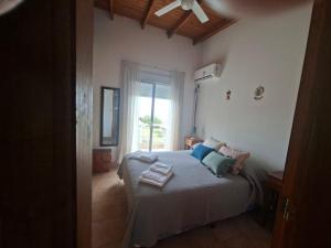 En eller flere senge i et værelse på Tranquilo duplex frente al mar