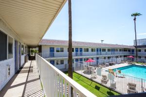 a balcony view of a hotel with a swimming pool at Motel 6 Mesa North in Mesa