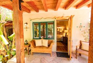 a porch of a house with a door open at The Emerald Iguana Inn in Ojai