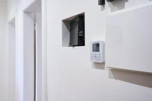 a door with a security box on the side of a building at Dimora Castelli Free Parking in Marghera