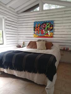 En eller flere senge i et værelse på Cabañas El Secreto