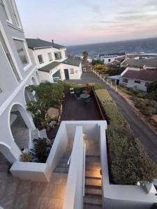 a house with stairs leading up to a yard at Villa Zoe in Glencairn