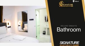 Ένα ή περισσότερα κρεβάτια σε δωμάτιο στο Signature Apartments