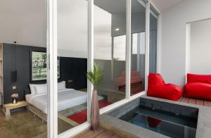 Ένα ή περισσότερα κρεβάτια σε δωμάτιο στο Angkor Serinity Hotel Siem Reap +21 φωτογραφίες