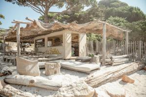 a house in the sand with at Ranch Campo Palombaggia in Porto-Vecchio