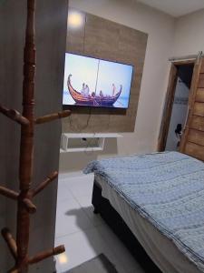 En eller flere senge i et værelse på Casa temporada