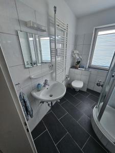 Ένα μπάνιο στο City-Apartments am Mühlbach-Kurpark