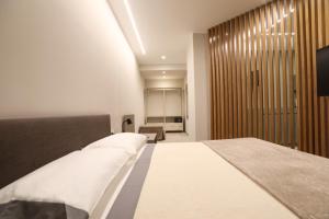 a bedroom with a large bed in a room at Casetta Miranda in Naples