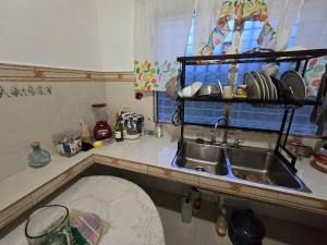 a kitchen with a sink and a counter top at Los Senderos Amados in Bajo Boquete +62 photos