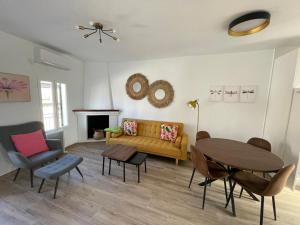 a living room with a couch and a table at Las Calas departamento ideal! in Sotillo de la Adrada