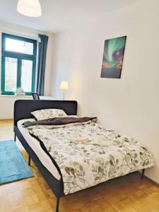 a bedroom with a bed in a room at Lebensfreude in Markkleeberg