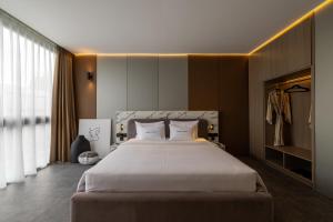 Giường trong phòng chung tại Awwa Boutique Hotel