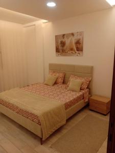 Ένα ή περισσότερα κρεβάτια σε δωμάτιο στο Jardin de Carthage 5 étoiles