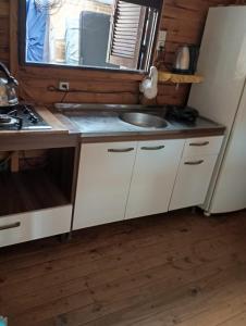 Η κουζίνα ή μικρή κουζίνα στο Casa de praia +3 φωτογραφίες