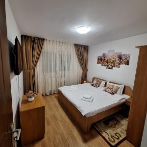 En eller flere senge i et værelse på Alexander Residence