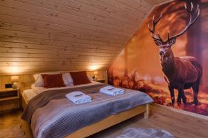 Ένα ή περισσότερα κρεβάτια σε δωμάτιο στο Domek na Wzgórzu