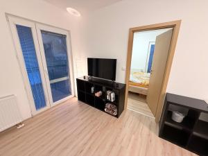 Μια τηλεόραση ή/και κέντρο ψυχαγωγίας στο Apartmán Bern +3 φωτογραφίες