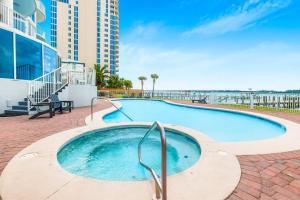 a swimming pool in the middle of a building at Bel Sole 1102 Spacious water view beach access in Gulf Shores