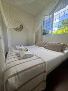 Postel nebo postele na pokoji v ubytování Villa Cristalline Douceur des Alizés + 52 fotografií