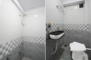 Ένα μπάνιο στο SPOT ON Hotel The Comfort Cove