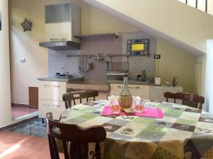 Кухня или мини-кухня в B&B La Tana dell'Orso
