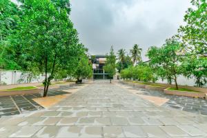 Κήπος έξω από το Super Townhouse Edassery Blue Bells