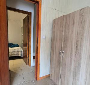 a room with a door leading to a bedroom at Departamento bahia fonck in Puerto Montt