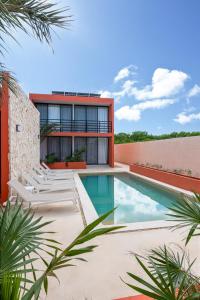 an image of a house with a swimming pool at The Retreat at Sisal in Sisal