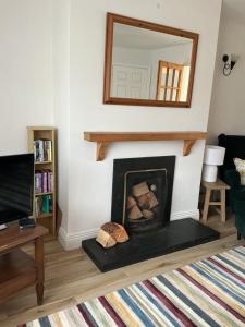 Μια τηλεόραση ή/και κέντρο ψυχαγωγίας στο Sunny Rosslare Strand Holiday Home