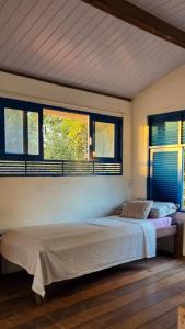 Ένα ή περισσότερα κρεβάτια σε δωμάτιο στο Casa luz