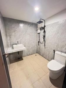 a bathroom with a toilet and a sink at Lanta Thai Cottage, Bamboo House in Ko Lanta