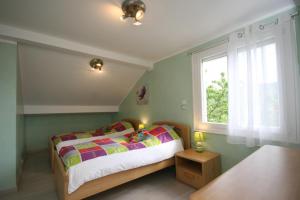 Ένα ή περισσότερα κρεβάτια σε δωμάτιο στο Le Chalet "Les Breuches"