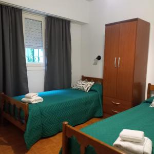 En eller flere senge i et værelse på Casa alquiler verano