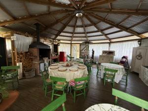 a large room with a table and chairs in it at Cabañas Boutique Faldeos de La Lajuela in Santa Cruz